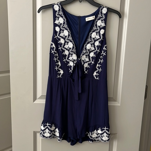 Promesa Pants - Navy with white lace romper size small. Brand is promesa